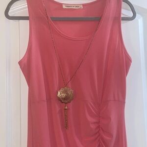 A beautiful light pink peach color with a accessory